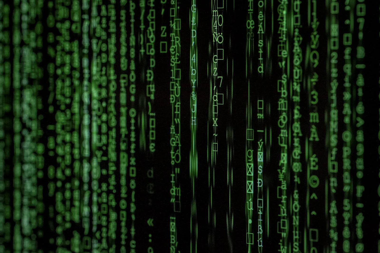 Matrix-style cascading green code representing AI-driven cybersecurity platform data processing in 2026
