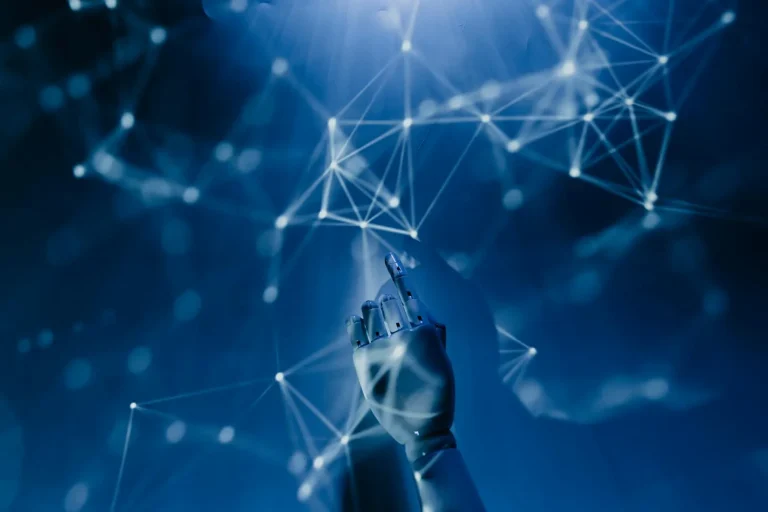 Robotic artificial intelligence hand pointing upward connecting to a network of glowing nodes on blue background