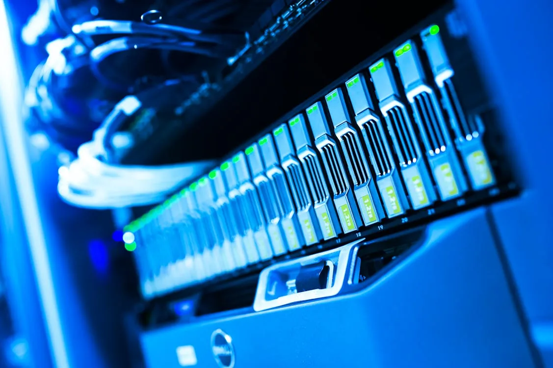 Blue-lit server rack in data center representing AI cloud security and automated risk management