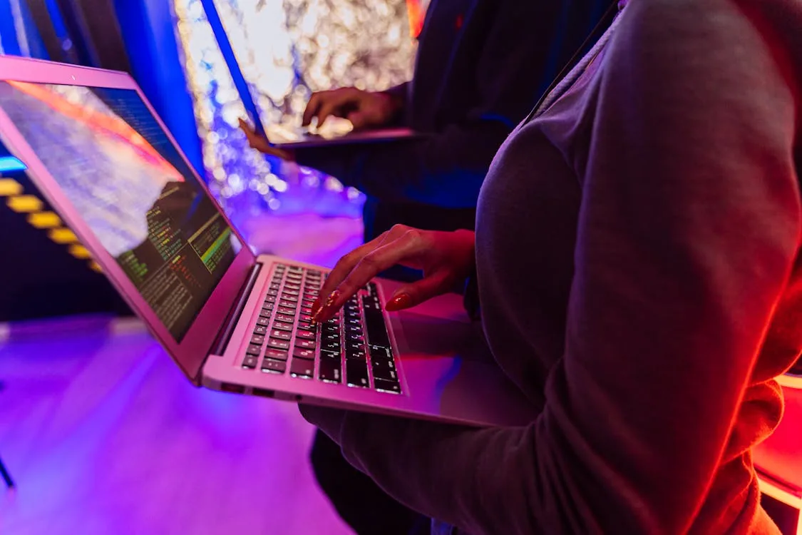 Security professionals working on laptops for AI-powered identity and access management