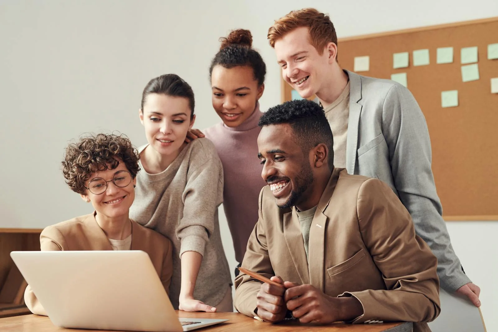 Government cybersecurity team reviewing AI security protocols on laptops