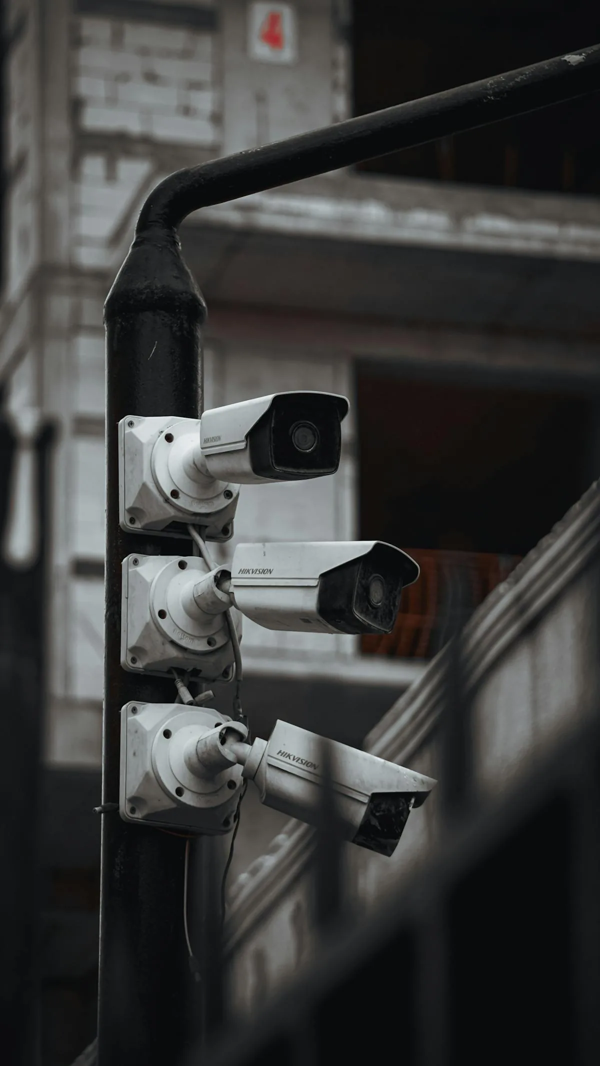 Multiple security cameras demonstrating AI surveillance deployment across markets