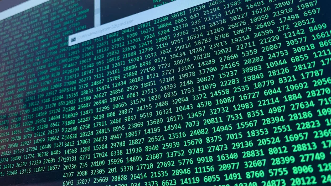 Green code on computer screen representing AI-generated polymorphic malware and autonomous cyberattacks