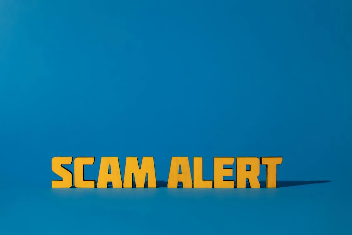 Scam Alert warning representing AI-generated phishing and deepfake social engineering threats