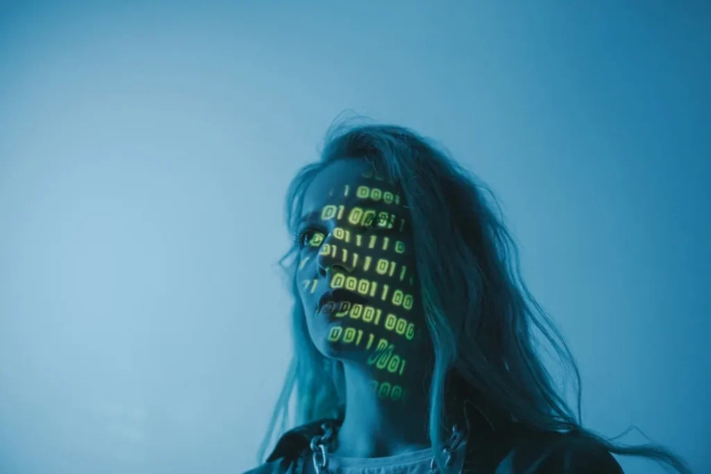 Woman with binary code projected on face representing artificial intelligence security tools and AI-powered threat detection