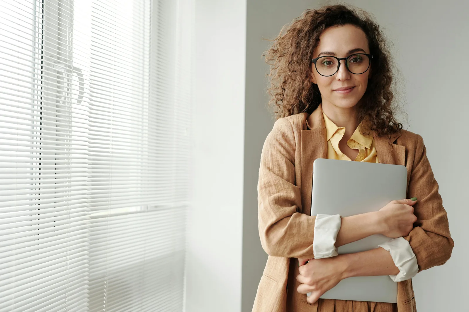 Cybersecurity professional working at computer in bright modern office representing BSc intelligence and cyber security studies career outcomes salary entry requirements