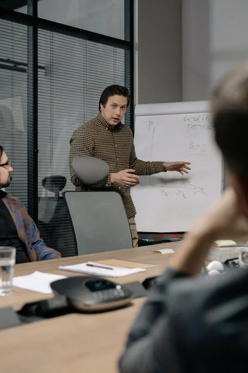 Corporate security team reviewing threat intelligence dashboard in bright modern security operations center representing corporate security intelligence GSOC architecture scope