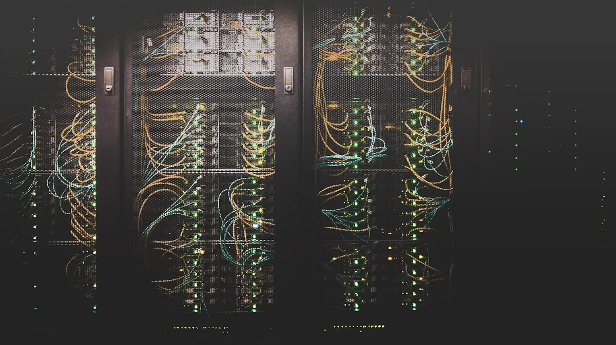 Data center server rack with orange fiber optic cables illustrating the infrastructure behind cyber security intelligence services lifecycle