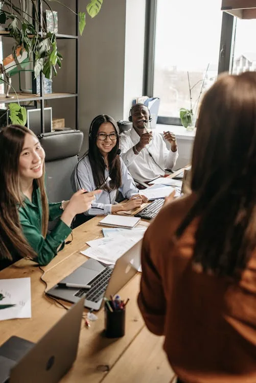 Security professional presenting at global intelligence briefing in bright modern conference room representing global security intelligence jobs qualifications salary career progression
