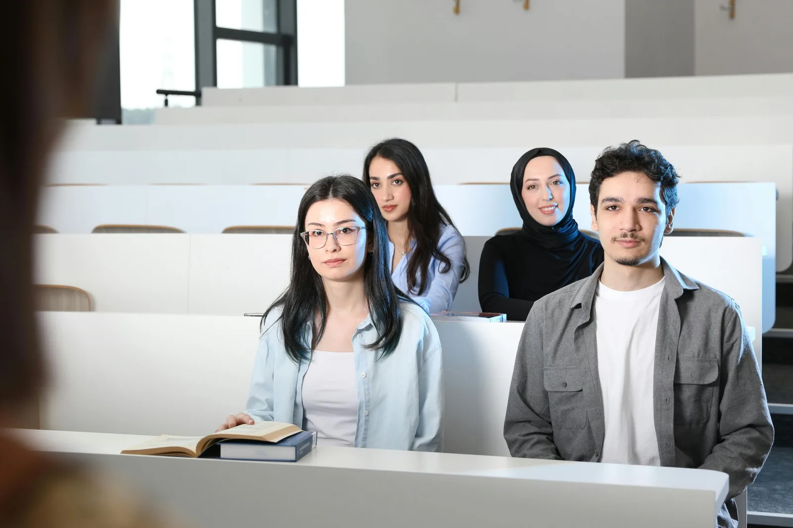 University students studying intelligence and cyber security program curriculum in bright modern classroom representing intelligence and cyber security studies degree programs universities
