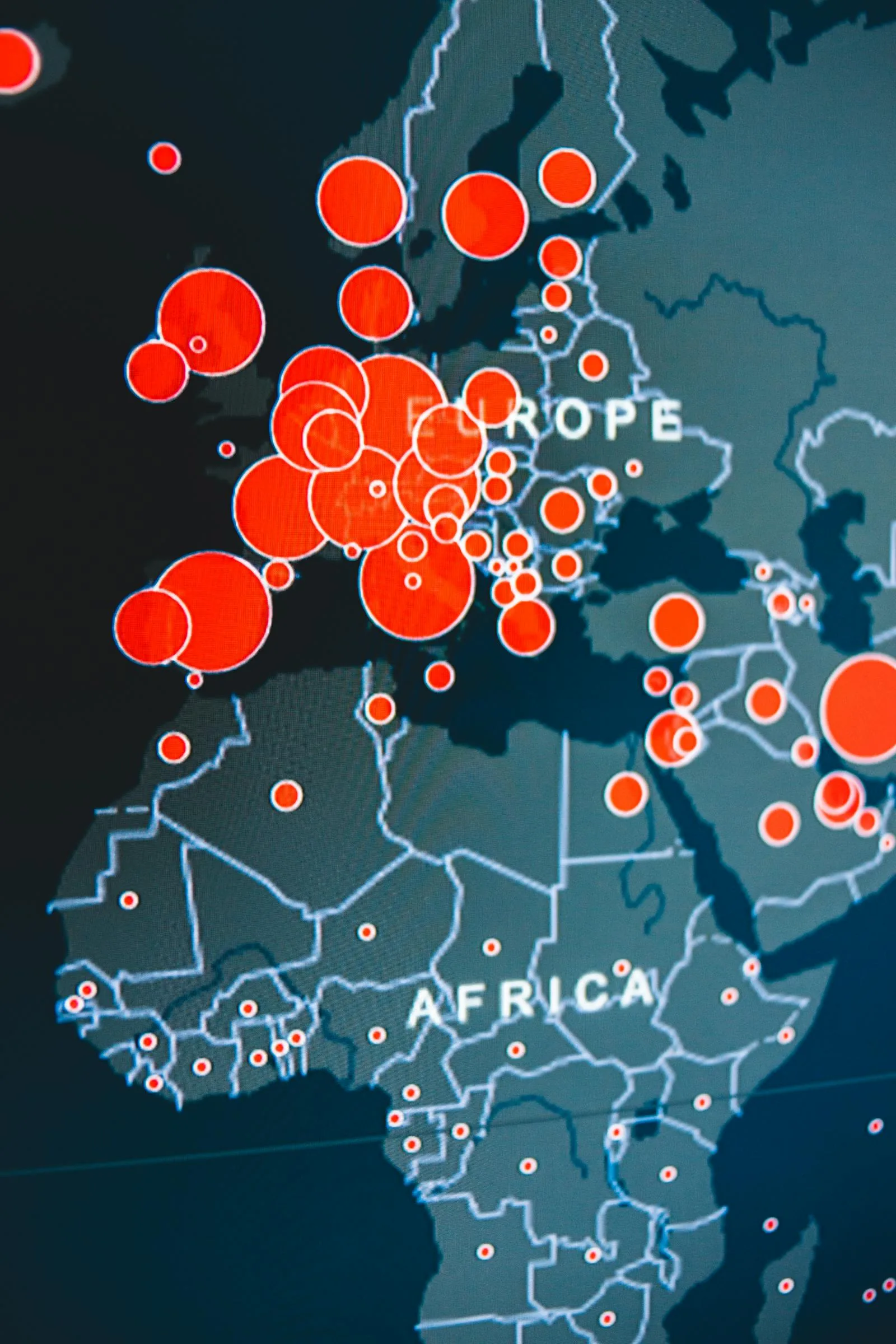 Digital world map with red threat indicators across Europe and Africa representing global cyber threat assessment from the 2026 US intelligence community report