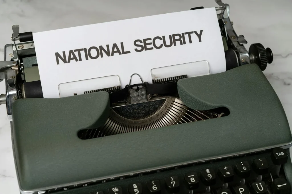 Vintage typewriter with paper reading National Security representing the Intelligence and National Security Summit