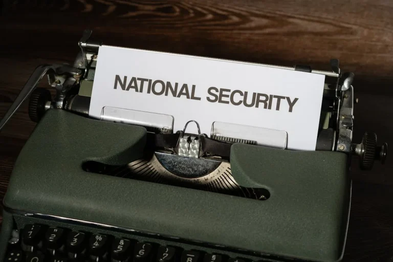 Vintage typewriter with paper reading National Security — representing national security intelligence services