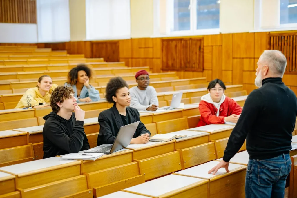 Diverse students in university lecture hall studying KU intelligence and national security degree program