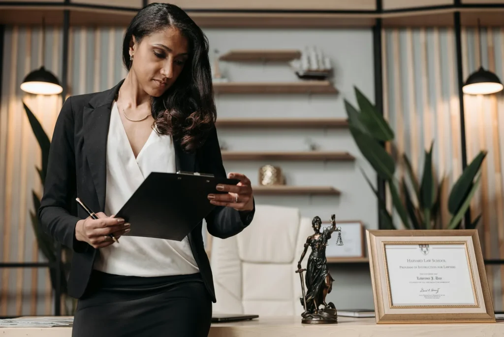 Legal professional reviewing AI cybersecurity regulation documents on laptop in bright modern office representing legality of artificial intelligence in cyber security EU AI Act regulation