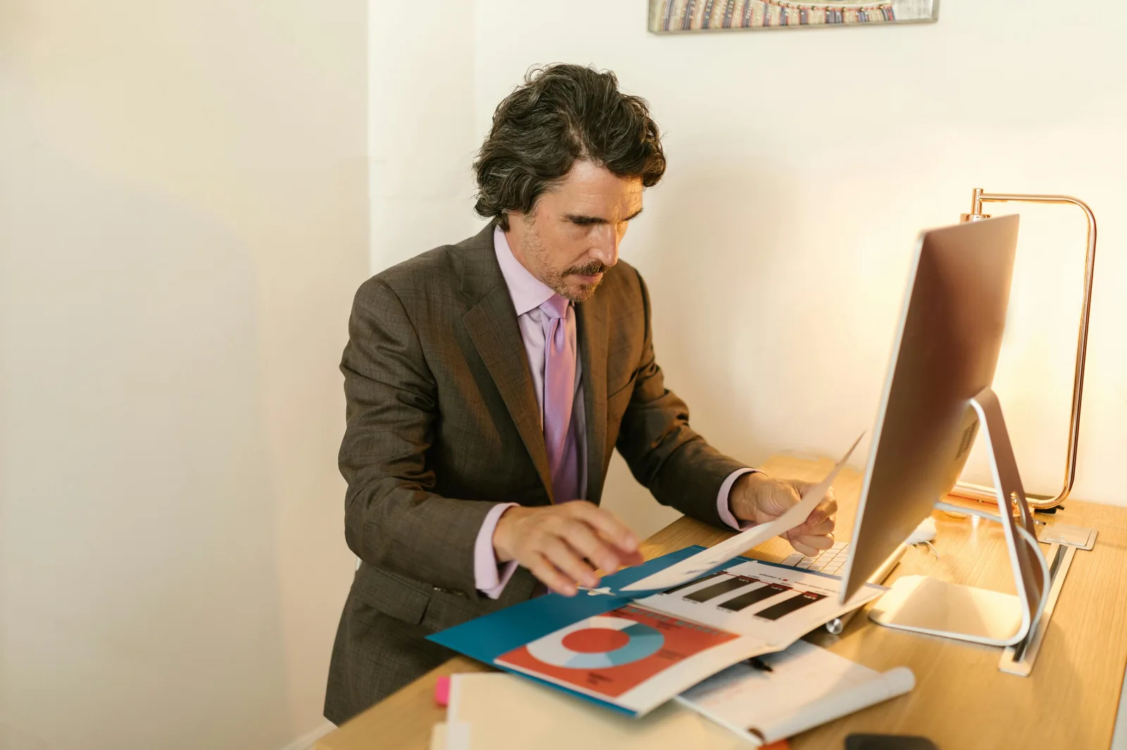 Security analyst working with Microsoft threat intelligence dashboard in bright modern operations center representing Microsoft security intelligence MSTIC MDDR 2025 scale