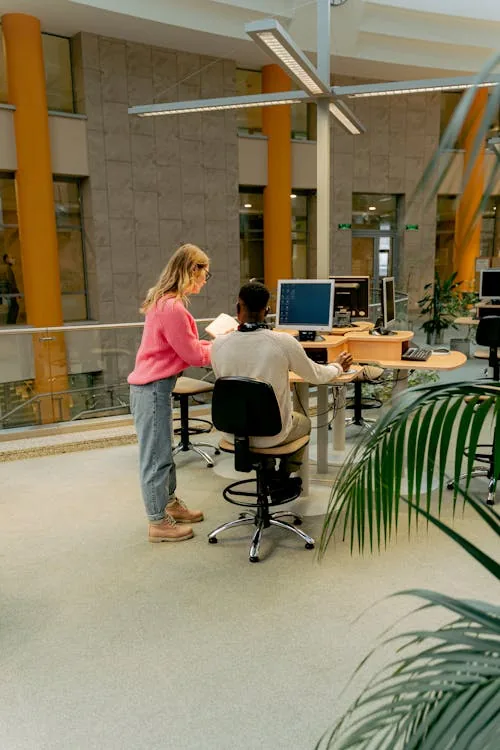 Security analyst performing open source intelligence research on multiple screens in bright modern office representing open source intelligence cyber security techniques passive active methods