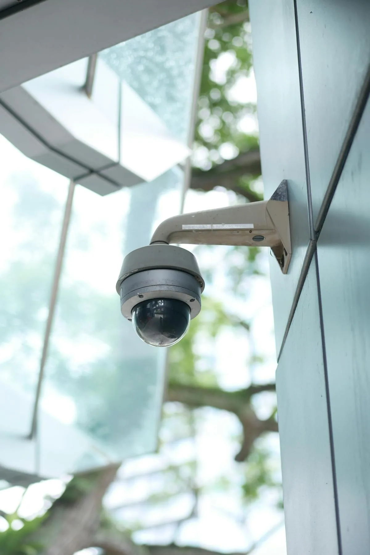 High-tech dome surveillance camera representing AI-powered physical security intelligence in 2026