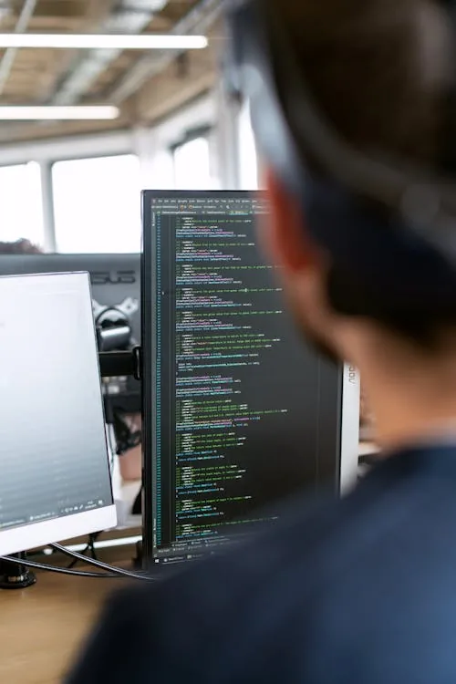 Cybersecurity team working on AI model security testing in bright modern workplace representing robust intelligence AI security landscape OWASP red teaming EU AI Act