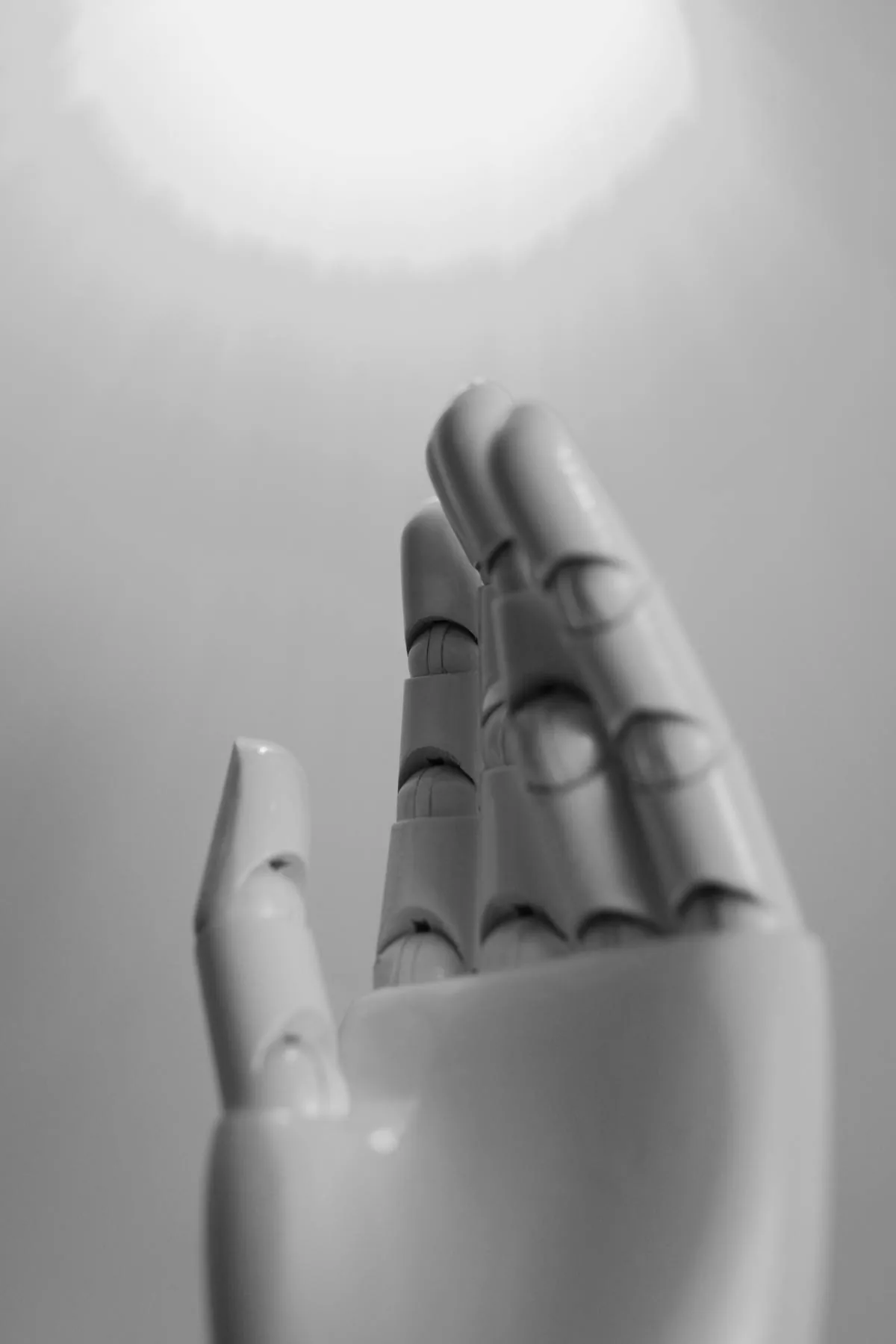 White robotic hand representing the growing AI cybersecurity market in 2026