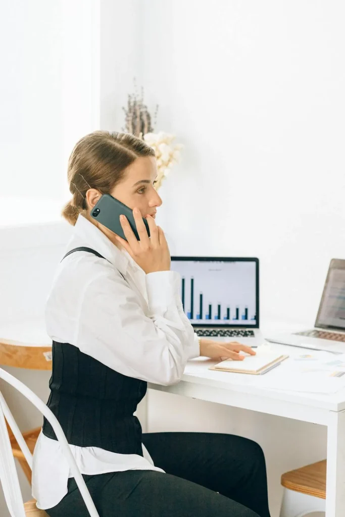 Security analyst working with behavioral analytics dashboards in bright modern office representing security intelligence analytics use cases UEBA network traffic analysis behavioral detection