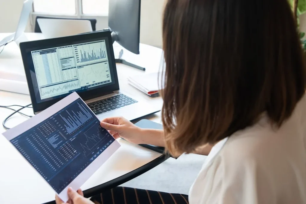 Security analyst reviewing threat intelligence feed data on monitors in bright modern office representing security intelligence feeds types free commercial STIX TAXII sources