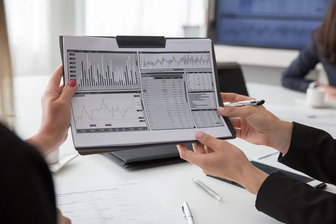 Security analyst reviewing threat intelligence feed data on monitors in bright modern office representing security intelligence feeds types free commercial STIX TAXII sources