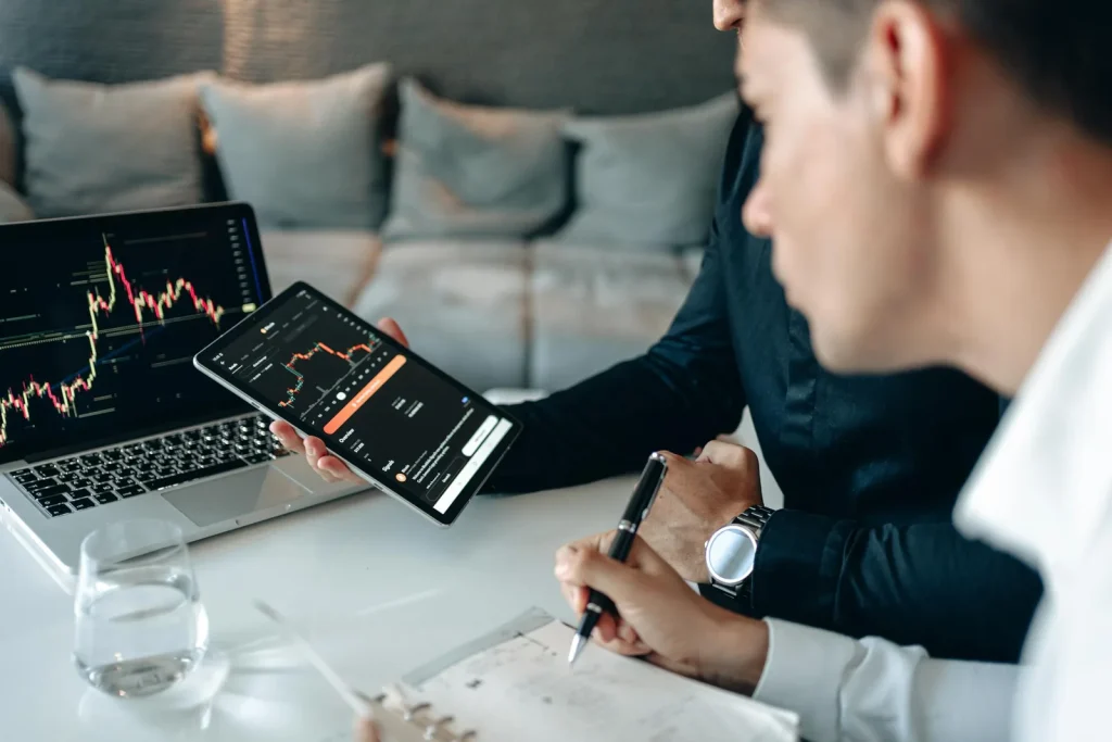 Security analysts reviewing market intelligence dashboards in bright modern financial office representing security intelligence market size growth SIEM threat intelligence AI cybersecurity