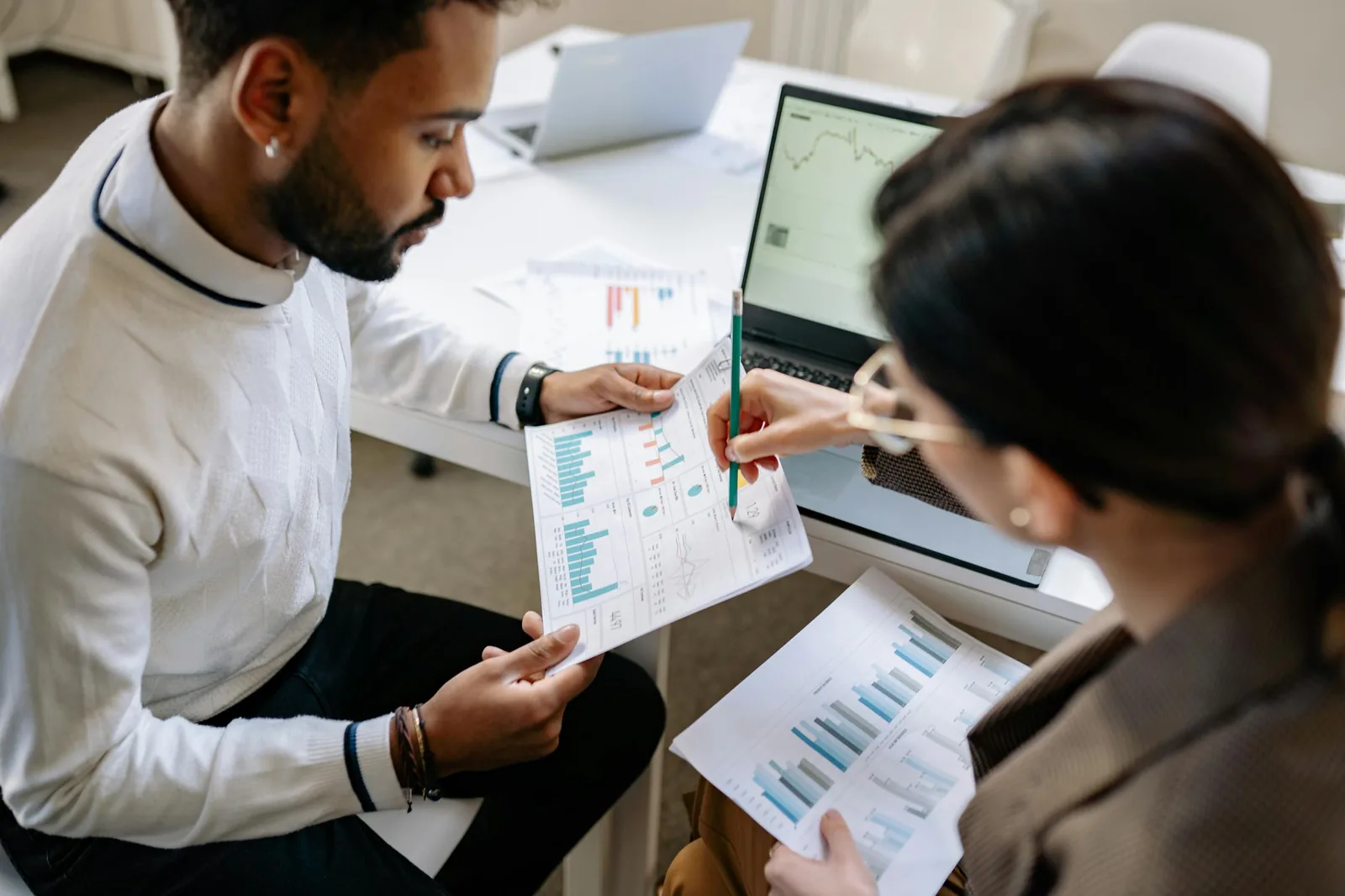 Security analysts reviewing market intelligence dashboards in bright modern financial office representing security intelligence market size growth SIEM threat intelligence AI cybersecurity