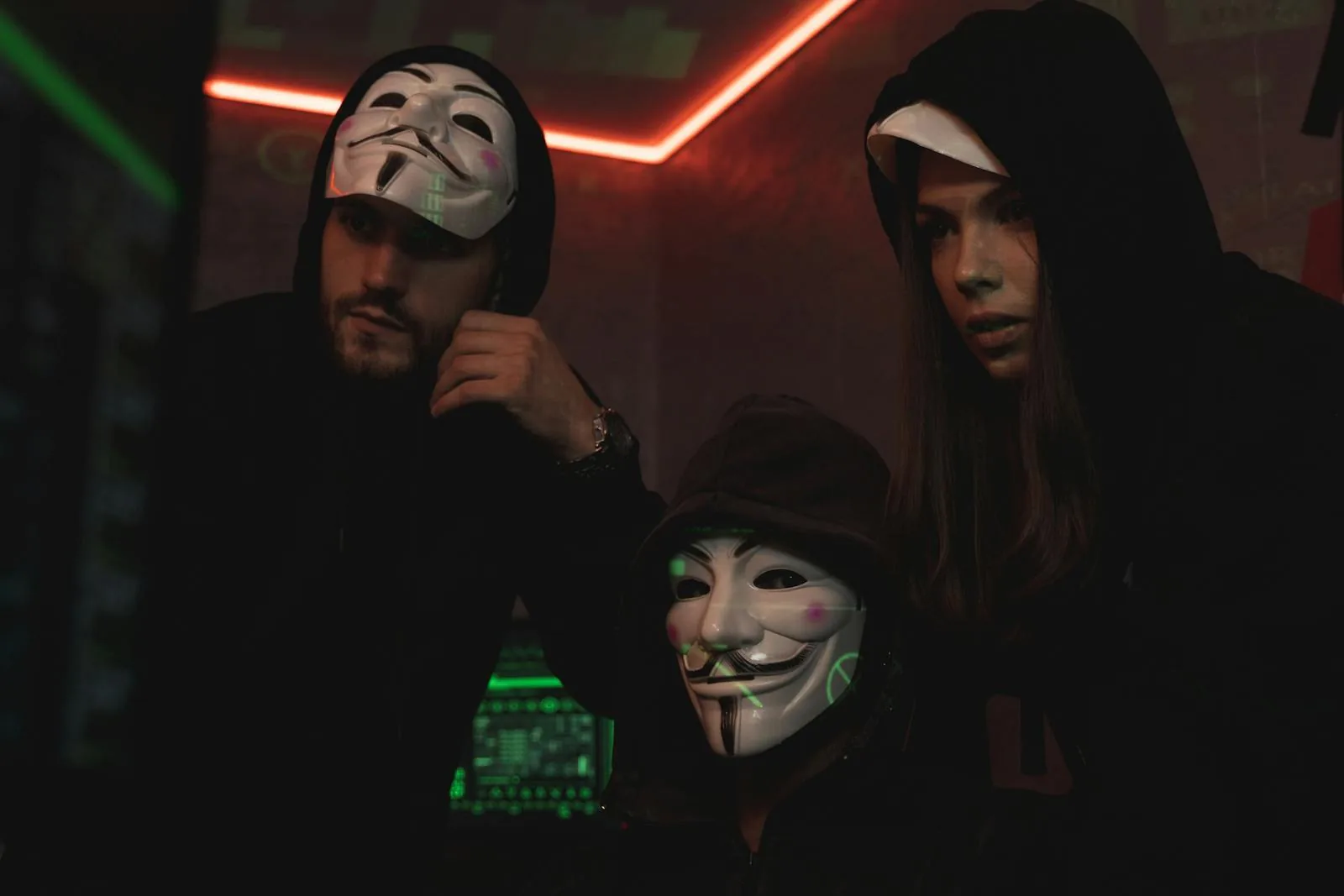 Masked hackers representing the adversary threats that mature security intelligence operations must address