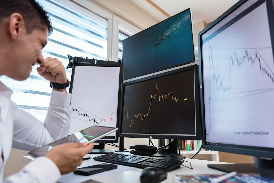Security analyst reviewing latest threat intelligence updates on monitor in bright operations center representing security intelligence update sources CISA vendor threat reports community feeds