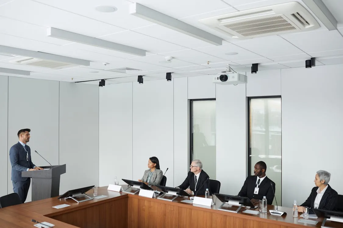 Security professional consulting with enterprise team about intelligence service selection in bright modern boardroom representing security intelligence company selection Mandiant Palo Alto specialist providers