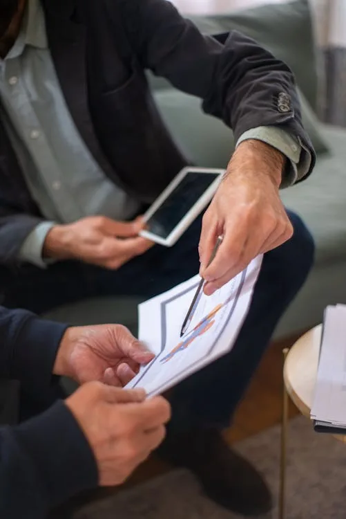 Security decision maker reviewing company rating evaluation matrix on tablet in bright modern office representing top rated security intelligence companies selection use case evaluation
